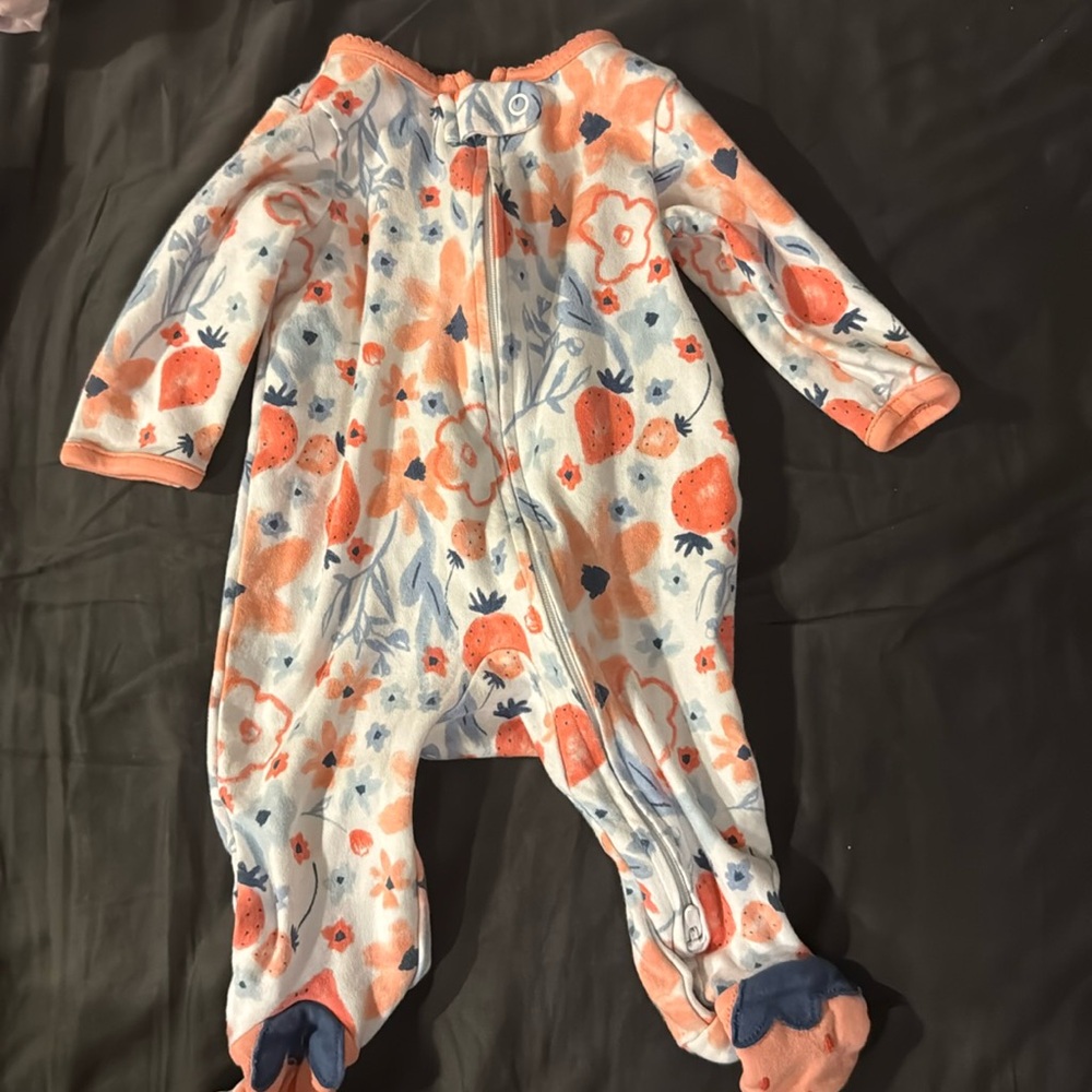 Blue and peach onesie
Caters 
Flowers and strawberries 
0-3 months